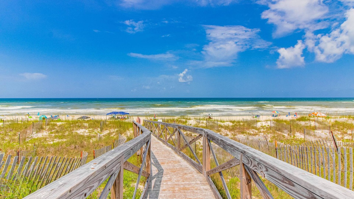Breezy townhome with shared pool & tennis, beach access - small dogs welcome