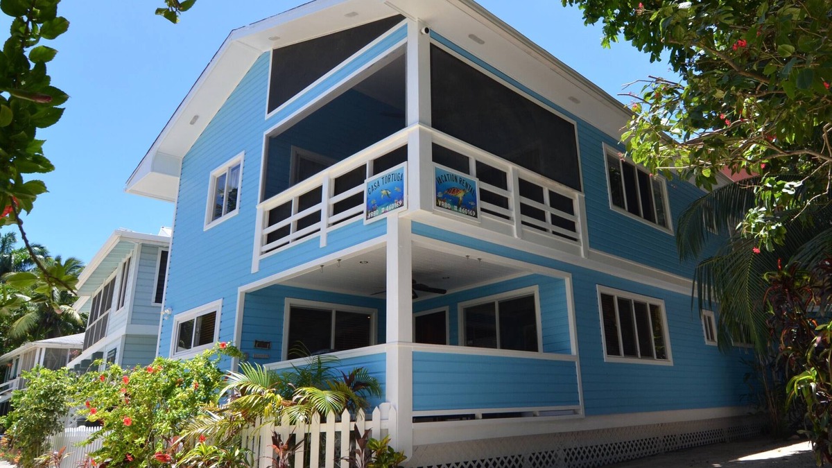 Oceanfront beach house with dual-masters & screened balcony on West Bay Beach