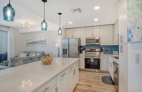 Newtown Condo | 1/1.5 Modern Waterfront Condo with Pool and Fitness Room