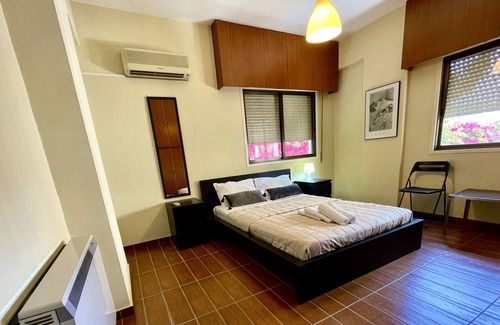 Acropolis Apartment | 1-BDR with covered parking free Wi Fi next to KPMG
