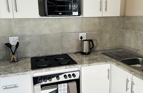 Windhoek Apartment | 1 bedroom apartment with stunning mountainous and sunset views.