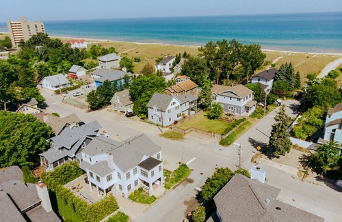 Michigan City House | 100 steps to Lake Michigan beach, private paved courtyard, gas fire pit.