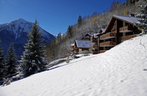 Champagny-en-Vanoise Apartment | 100m from resort center, 2nd floor, balcony, fireplace or stove, tv, ski locker, 55m²