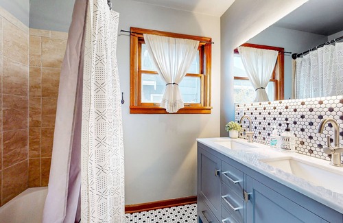 West End House | 1940s cottage with oak flooring, grill, hammock, & water views - dog-friendly