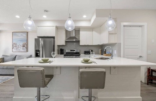 Sage Hill Apartment | 1BR Walk Out Suite » Backyard » Patio » 65” TV