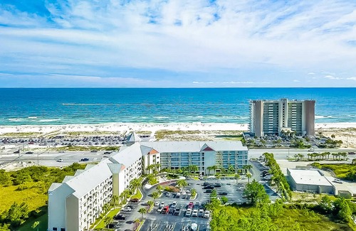 Orange Beach Condo | 1st floor condo with peek-a-boo Gulf views, balcony, central AC, WiFi, & pool