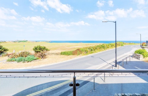 Lusty Glaze Apartment | 2 Bolowthas Court-Spacious apartment close to beaches, parking, coastal and sea views.