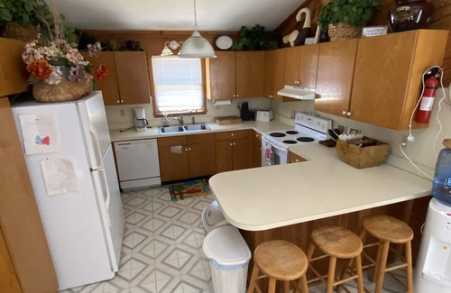 Carova Beach House | 2 Free beach parking passes! Waterfront Hot Tub Boat dock Pet friendly 360 Decks