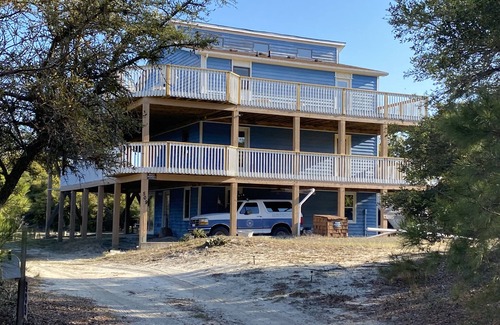 Carova Beach House | 2 Free beach parking passes! Waterfront Hot Tub Boat dock Pet friendly 360 Decks