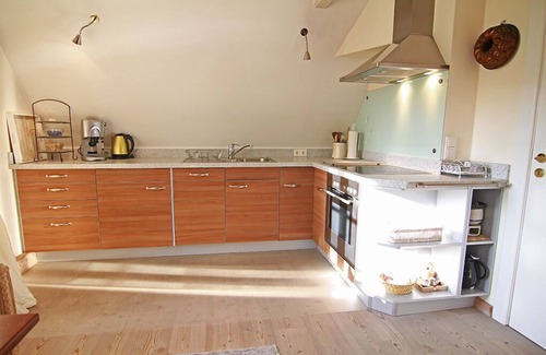Westerland Apartment | 2-room vacation apartment on the 1st floor with beach chair in front of the house.