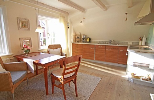 Westerland Apartment | 2-room vacation apartment on the 1st floor with beach chair in front of the house.
