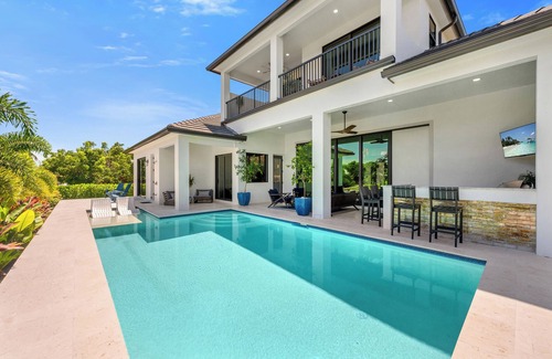 Marco Island House | 2024 4 Bed Home (Option- Golf Carts Rental) (Car rental option)- Water view with Heated Pool , Outdoor Kitchen/Bar
