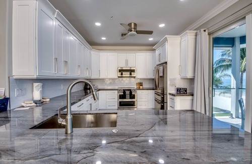 Mid Island House | 251 Key West Court: Luxurious Beachfront Home with Pool