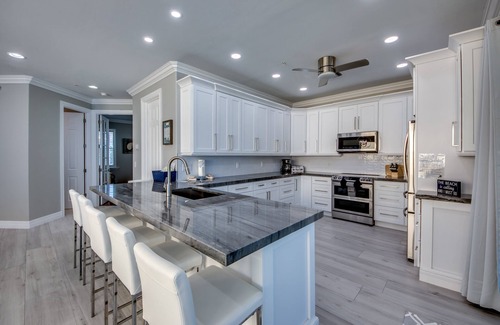 Mid Island House | 251 Key West Court: Luxurious Beachfront Home with Pool
