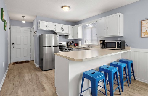 Caine Woods House | 2BR Family Friendly Condo w/Large Balcony, Partial Ocean Views, Outdoor Pool