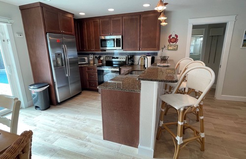 Holmes Beach House | 3 Bedroom, 2 Bath Ground Level with Heated Pool - Short walk to the beach.