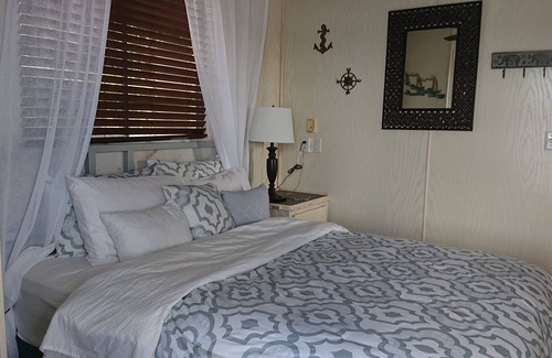 Port Saint Lucie Boat Rental | 3 Bedroom/2 Bath House Boat on Dock with 3 Acres of Private Land Near Downtown