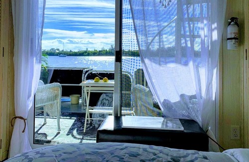 Port Saint Lucie Boat Rental | 3 Bedroom/2 Bath House Boat on Dock with 3 Acres of Private Land Near Downtown