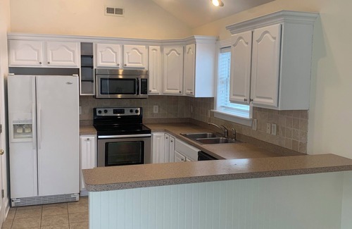 Kill Devil Hills Apartment | 3-bedroom apartment in lovely Kill Devil Hills with Tiki Bar