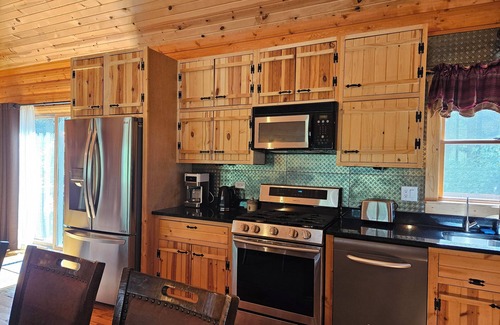 Adams Cabin | 4 Bedroom lodge on wooded land with heated swimming pool and hot tub