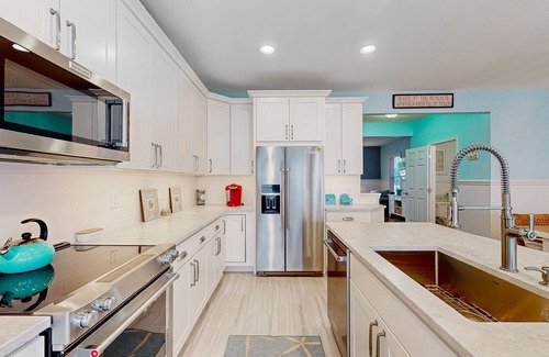 Sunset Island House | 4-story townhome with resort pools, beaches, water access, & great location