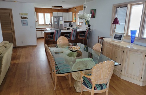 Ocean Isle Beach House | 4bd Canal Front home with an Elevator, dock, fenced back yard, 2 master suites