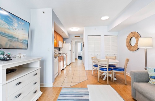 North Myrtle Beach Condo | 4th-floor condo with pool, Hot Tub, private W/D, marina view, & central AC