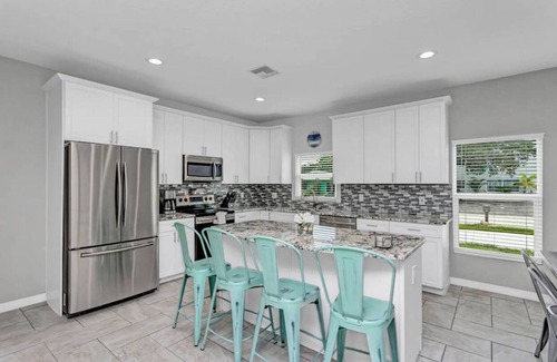 Port Canaveral House | 5 BR beach House, heated salt water pool, hot tub, King bed, & walk to the beach