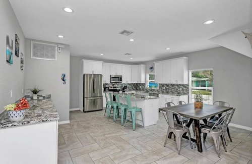 Port Canaveral House | 5 BR beach House, heated salt water pool, hot tub, King bed, & walk to the beach