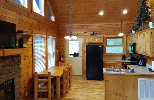 Pigeon Forge Cabin | 5 Min to the Parkway 3 Master Bdrms 3 Baths Sleeps 14 Fun Game Room and Hot Tub!