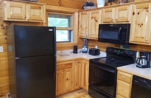 Pigeon Forge Cabin | 5 Min to the Parkway 3 Master Bdrms 3 Baths Sleeps 14 Fun Game Room and Hot Tub!