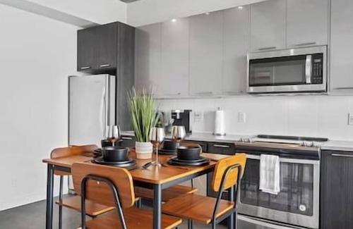 East Village Apartment | 5 min Walk to Stampede | King Bed | Sofa Bed | AC