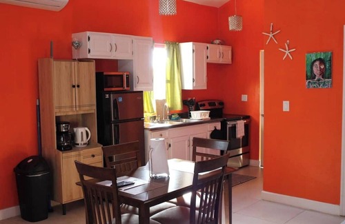 Leeward Settlement Apartment | 55 Oasis Cottage. Studio suite. Nearby World's #1 Grace Bay Beach.