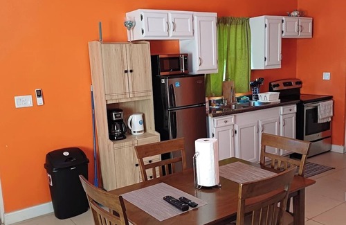 Leeward Settlement Apartment | 55 Oasis Cottage. Studio suite. Nearby World's #1 Grace Bay Beach.