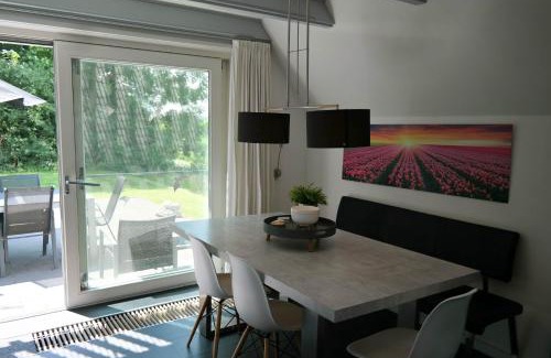 Anjum House | 6 Pers - Holiday home with sunny terrace by a typical Dutch canal