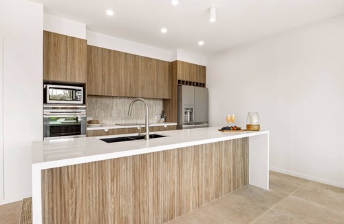 Mooloolaba House | 7 bedroom home on canal with private jetty for casual fishing and separate living areas for the exte