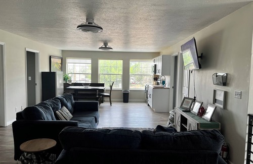 Orangeville House | 8 Bedroom 6 Bathroom home with kitchen, dining room area and lounge.