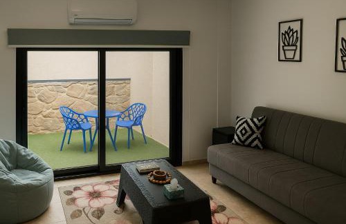 Sheikh Zayed City Apartment | 819. 2BR Townhouse Sofa Bed TVs 2 Baths Garden