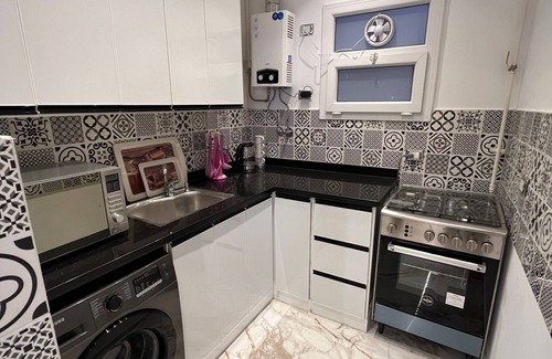 6th of October City Apartment | a beautiful building with nice bedrooms and kitchen and garden area. Living best