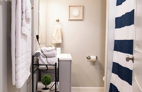 Shawnee Apartment | A charming bedroom with a king bed in quiet Shawnee neighborhood near highways.
