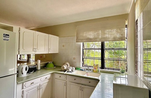 Oistins Condo | A condo Oasis up the hill from Miami Beach!