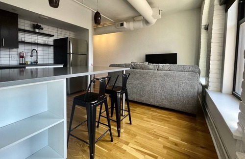Downtown Omaha Apartment | A historic 900 square foot Atrium loft in the heart of the Old Market
