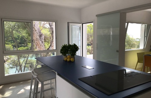 Portopetro Villa | A large villa with garden and terraces at the water's edge