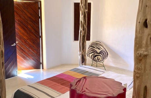 Costa Careyes Villa | A Mexican oasis of artistry + style with private stairs to beach and boat.