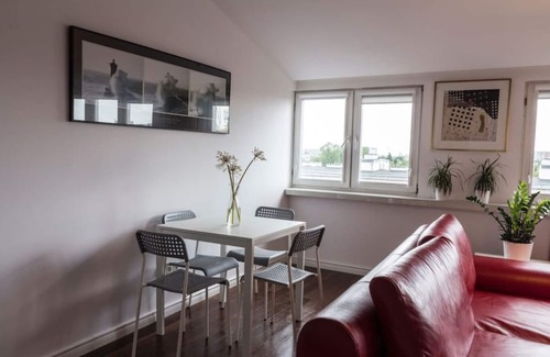 Mokotow Condo | A modern city apartment with good views.