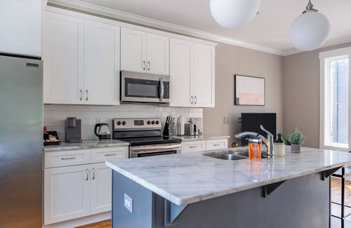 Katie Hill Neighborhood House | A modern two-bedroom/2.5 Bathroom townhome in East Nashville. Come enjoy this amazing rooftop! Our home includes a spacious garage for two vehicles. This newly built home is only a 10-min drive to most attractions including Broadway, Nissan Stadium,