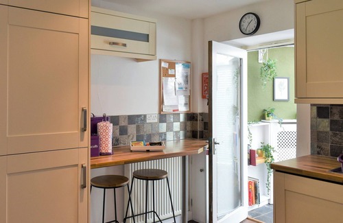 Rhuddlan Cottage | A picturesque cottage nestled in a quiet lane opposite the remains of Rhuddlan Castle .