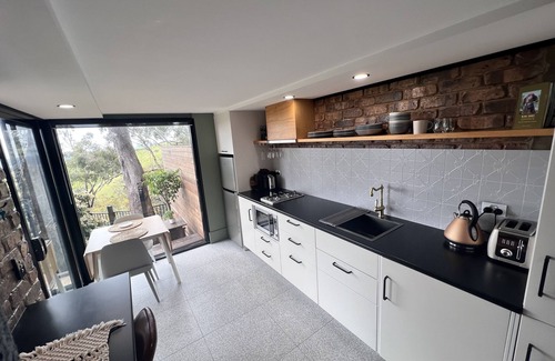 Belair Apartment | A place to relax in peace. Spa, fire pit, city lights and a pool.