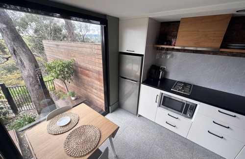 Belair Apartment | A place to relax in peace. Spa, fire pit, city lights and a pool.