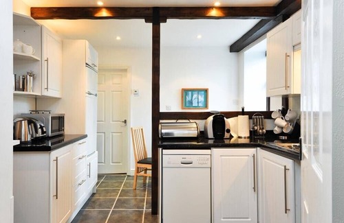 Staveley Cottage | A RIVER RUNS BY, with a garden in Staveley
